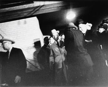(LEE HARVEY OSWALD ASSASSINATION) A pair of photographs from the moments before Lee Harvey Oswald was assassinated by Jack Ruby.